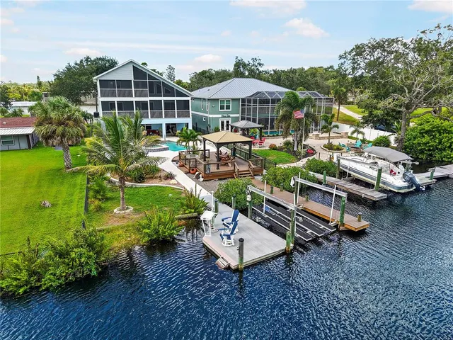 a view of a patio with furniture and garden