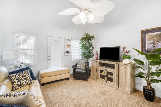 a bedroom with furniture and a flat screen tv