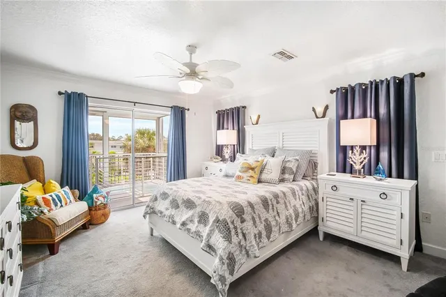 a bedroom with a bed couch and a window