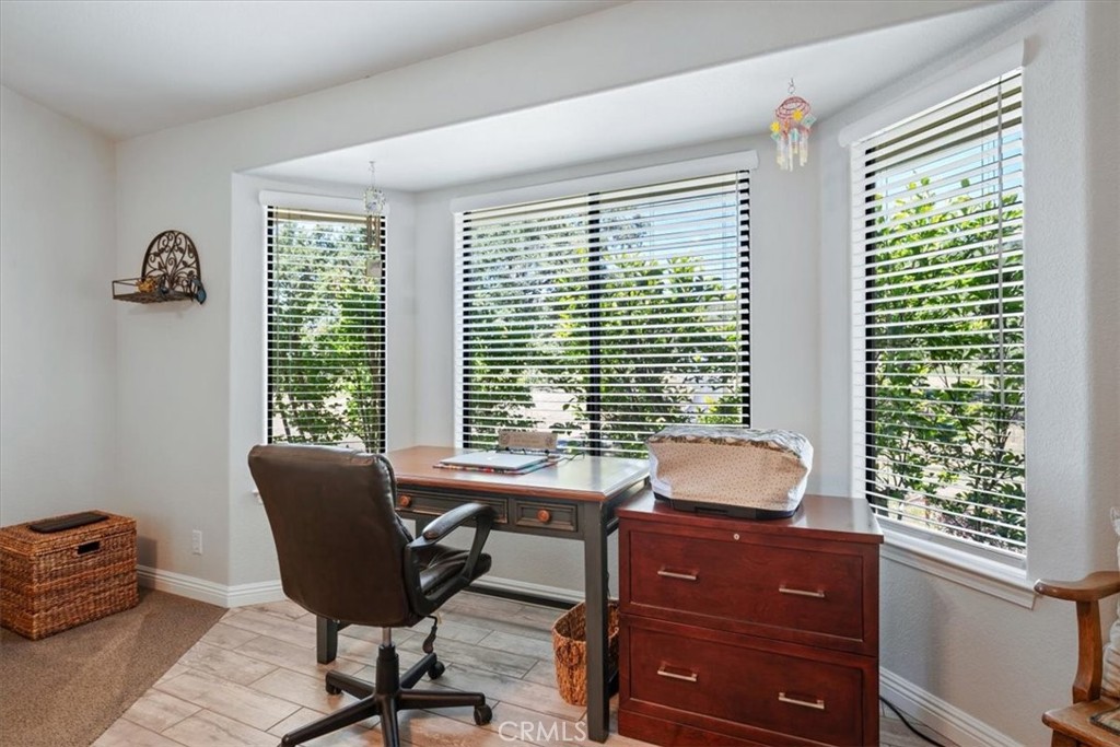 11625 Cenegal Road Atascadero, CA 93422 - Photo 13 of 54 a room with a window and a chair