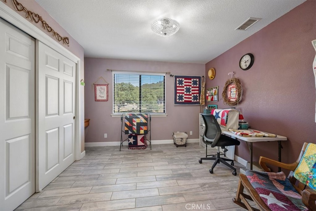 11625 Cenegal Road Atascadero, CA 93422 - Photo 19 of 54 a view of a workspace with furniture and a window