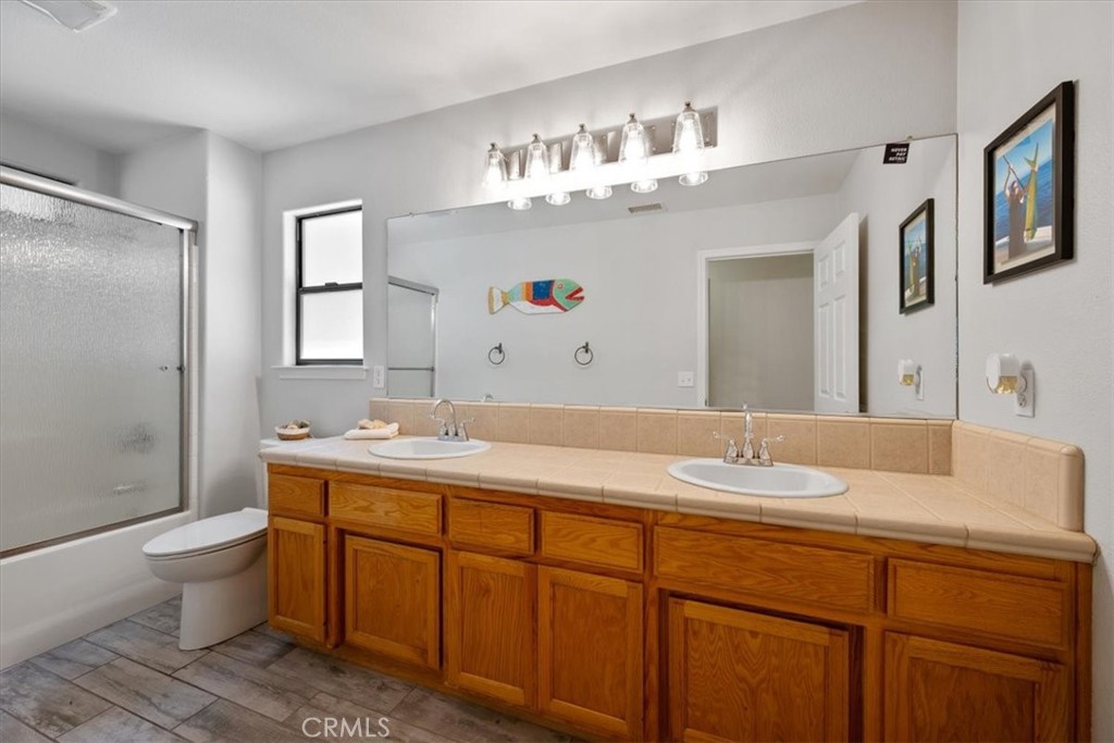 11625 Cenegal Road Atascadero, CA 93422 - Photo 20 of 54 a bathroom with a sink double vanity granite and a mirror