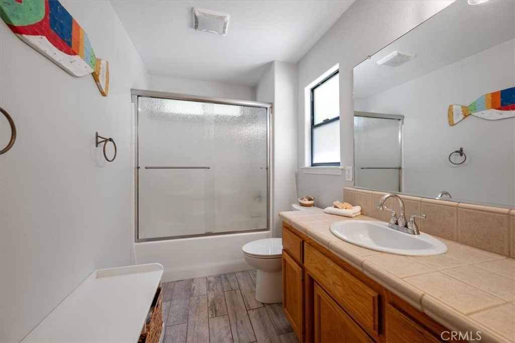 11625 Cenegal Road Atascadero, CA 93422 - Photo 21 of 54 a bathroom with a sink a toilet and shower