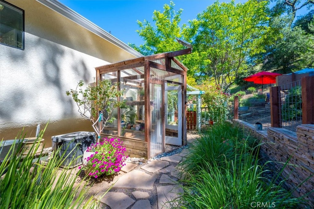 11625 Cenegal Road Atascadero, CA 93422 - Photo 26 of 54 a view of a patio with table and chairs potted plants