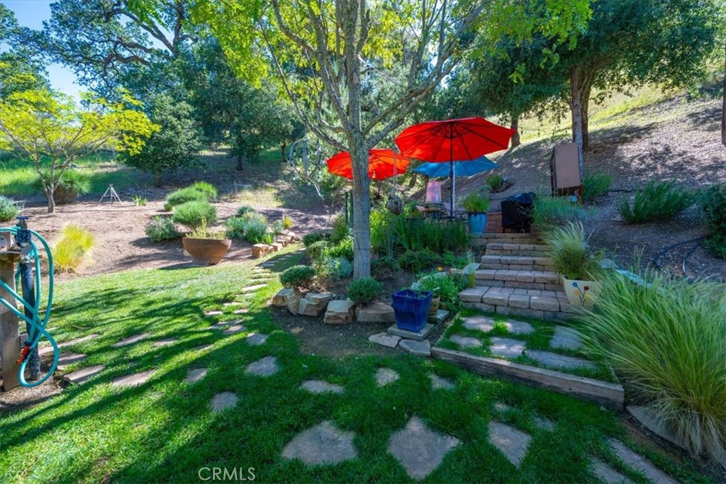 11625 Cenegal Road Atascadero, CA 93422 - Photo 32 of 54 a view of a backyard with a patio and garden