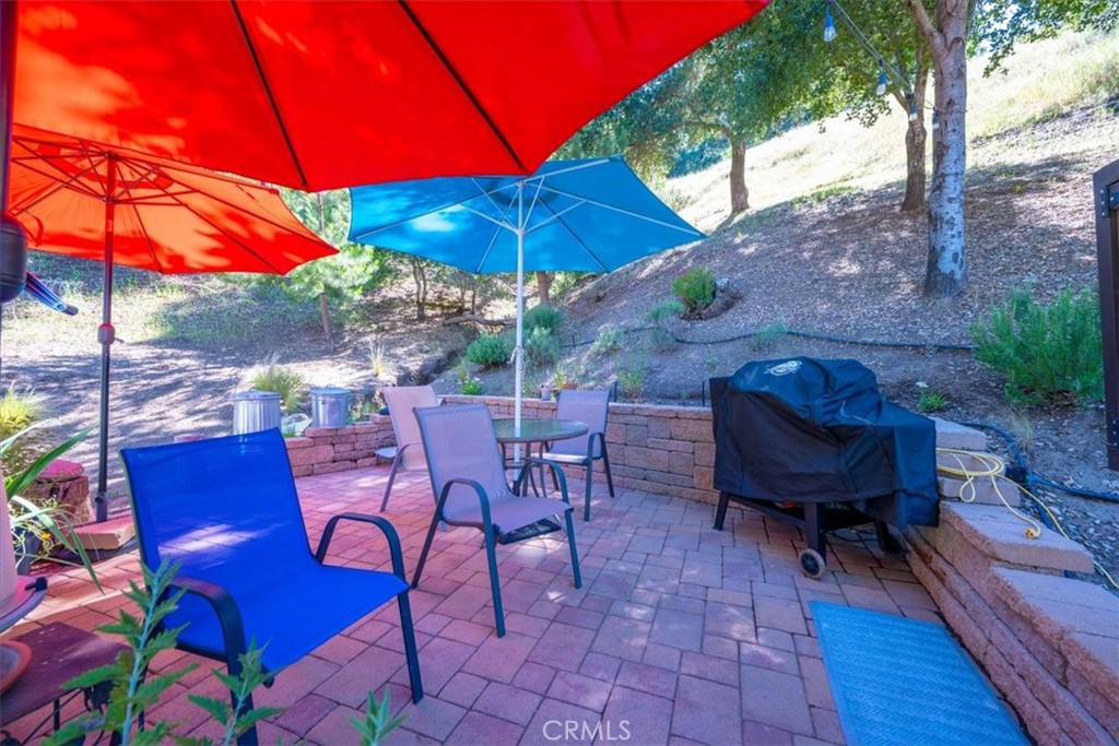 11625 Cenegal Road Atascadero, CA 93422 - Photo 34 of 54 a view of a chairs and table in the backyard