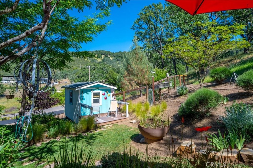 11625 Cenegal Road Atascadero, CA 93422 - Photo 36 of 54 a front view of a house with a yard and sitting area