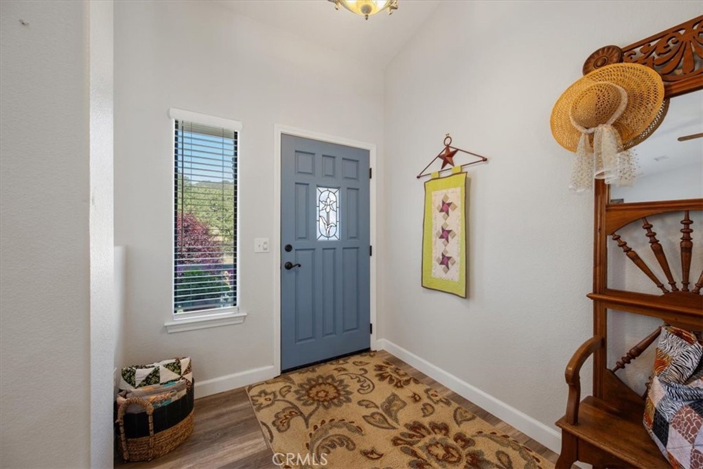 11625 Cenegal Road Atascadero, CA 93422 - Photo 4 of 54 a bedroom with a bed and wooden floor