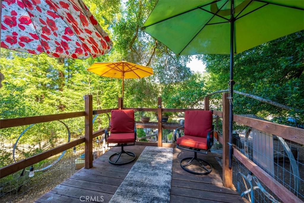 11625 Cenegal Road Atascadero, CA 93422 - Photo 43 of 54 an outdoor sitting area with furniture and umbrella