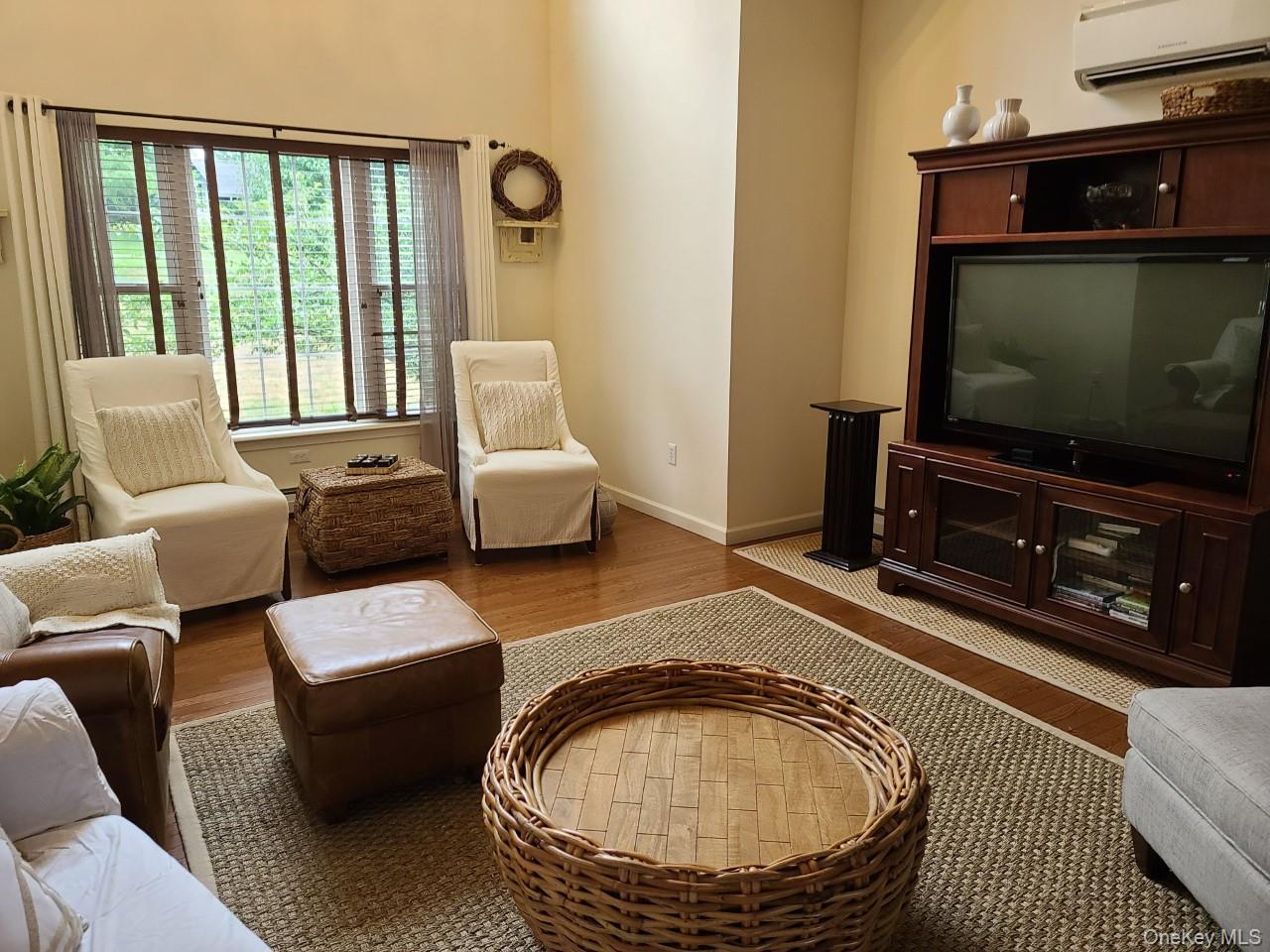 11 Beacham Road Rhinebeck, NY 12572 - Photo 3 of 27 a living room with furniture and a flat screen tv