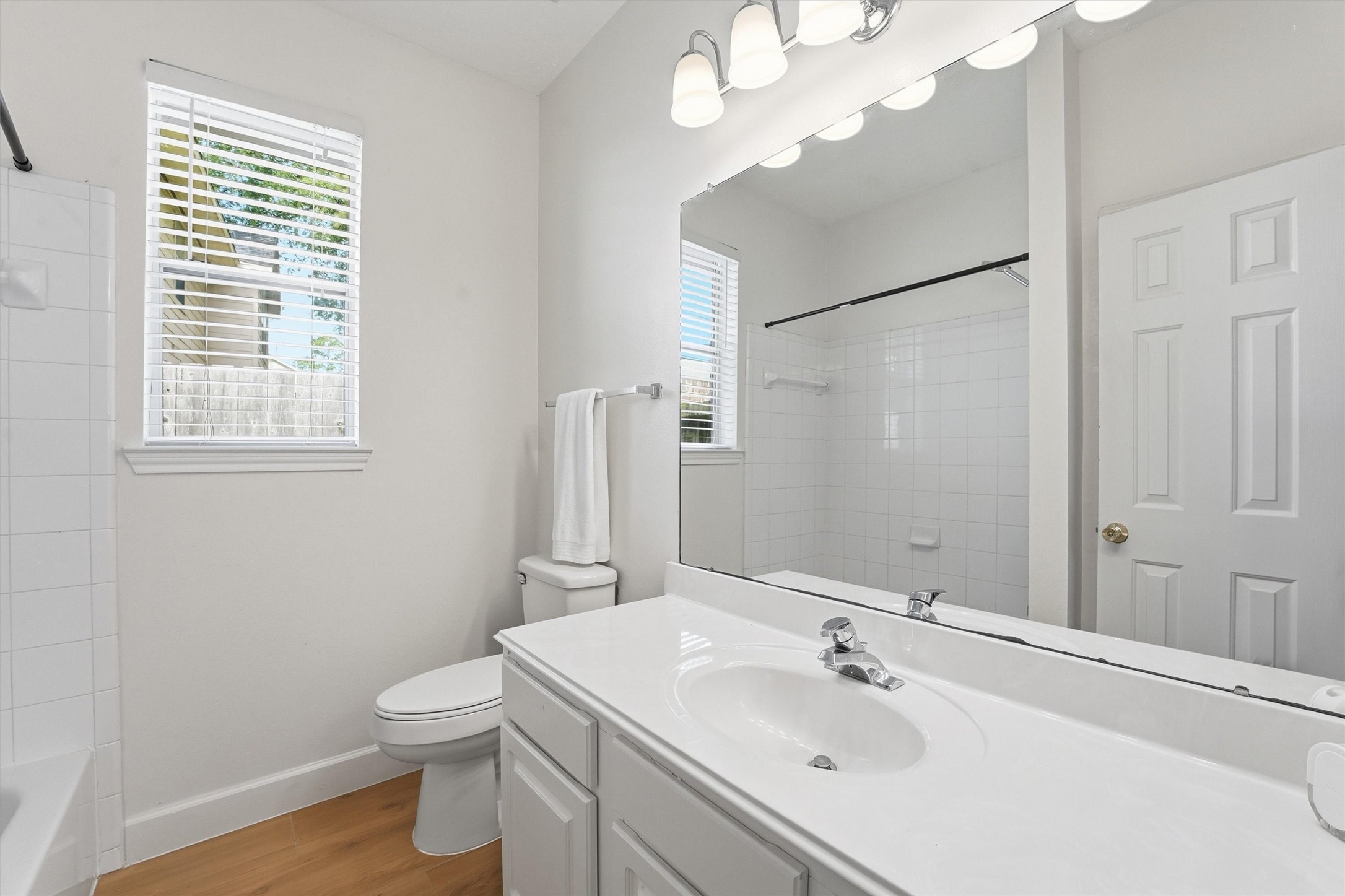 20507 Delta Wood Trail Humble, TX 77346 - Photo 20 of 28 a bathroom with a sink a toilet and a mirror