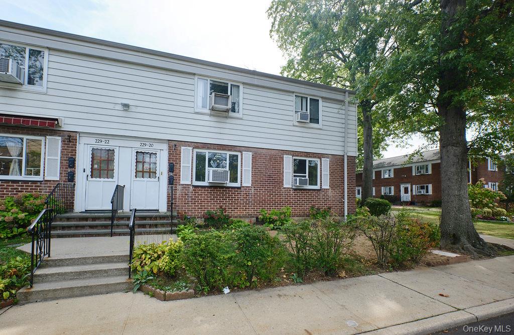View of front facade featuring brick siding