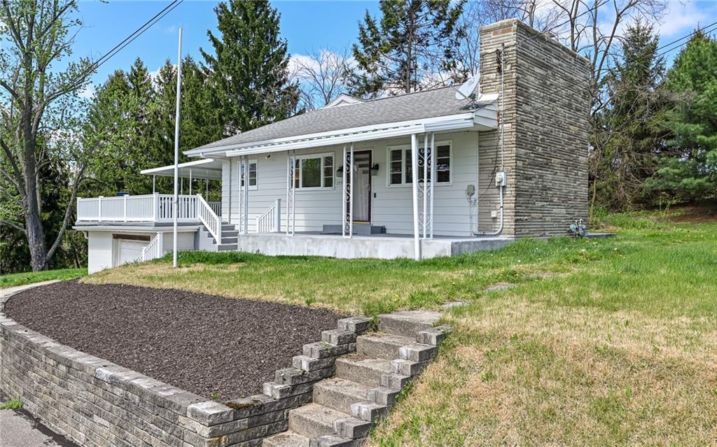 2559 Nicholson Road Sewickley, PA 15143 - Photo 2 of 24 Handsomely designed stacked stone fireplace adds character to this home nestled on .69 acre lot.