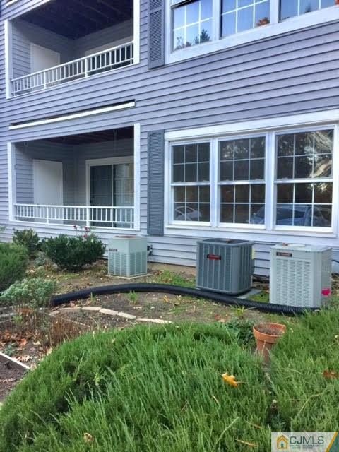 201 Raintree Court, Unit 201 Helmetta, NJ 08828 - Photo 17 of 20 a house view with a garden space