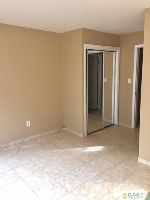 201 Raintree Court, Unit 201 Helmetta, NJ 08828 - Photo 9 of 20 a view of an empty room