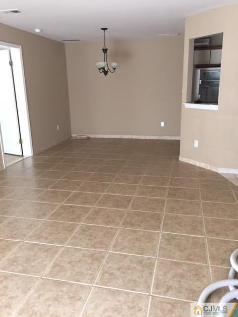 201 Raintree Court, Unit 201 Helmetta, NJ 08828 - Photo 10 of 20 a view of a livingroom with a bathroom