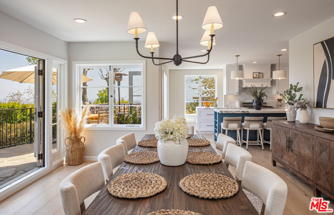 1756 Correa Way Los Angeles, CA 90049 - Photo 13 of 38 a living room with furniture and a large window