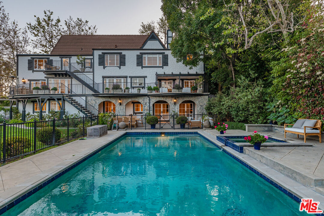 1756 Correa Way Los Angeles, CA 90049 - Photo 2 of 38 a front view of house with yard and outdoor seating