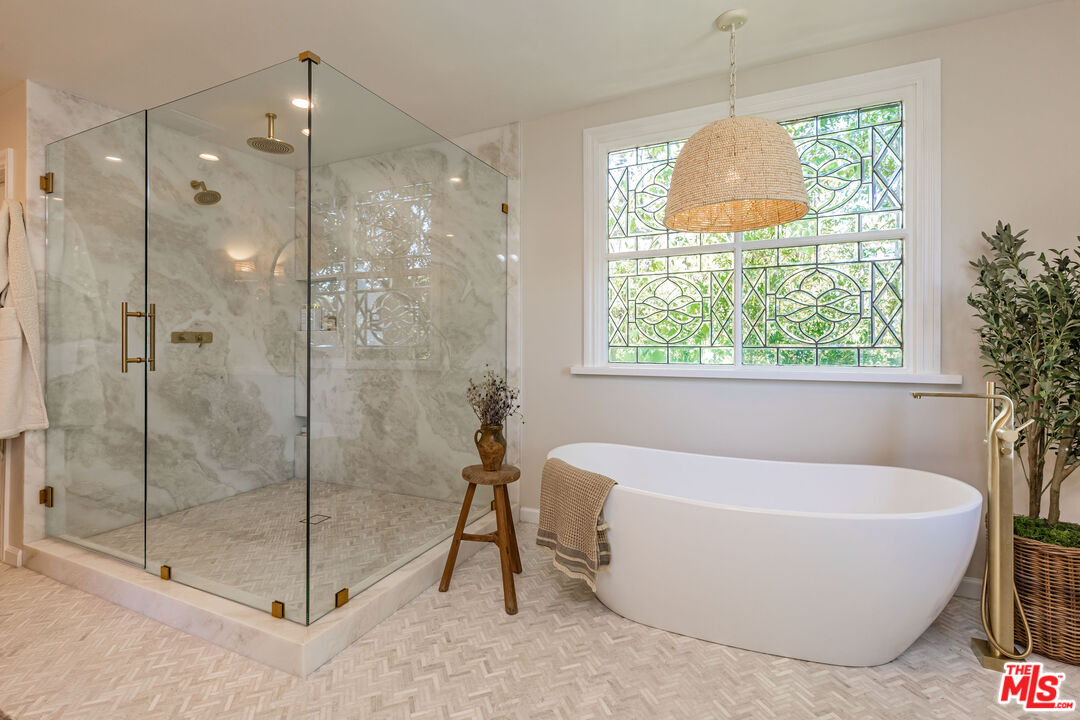 1756 Correa Way Los Angeles, CA 90049 - Photo 21 of 38 a white bath tub sitting next to a window