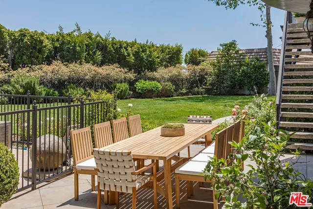 a view of a deck with a table and chairs with wooden floor