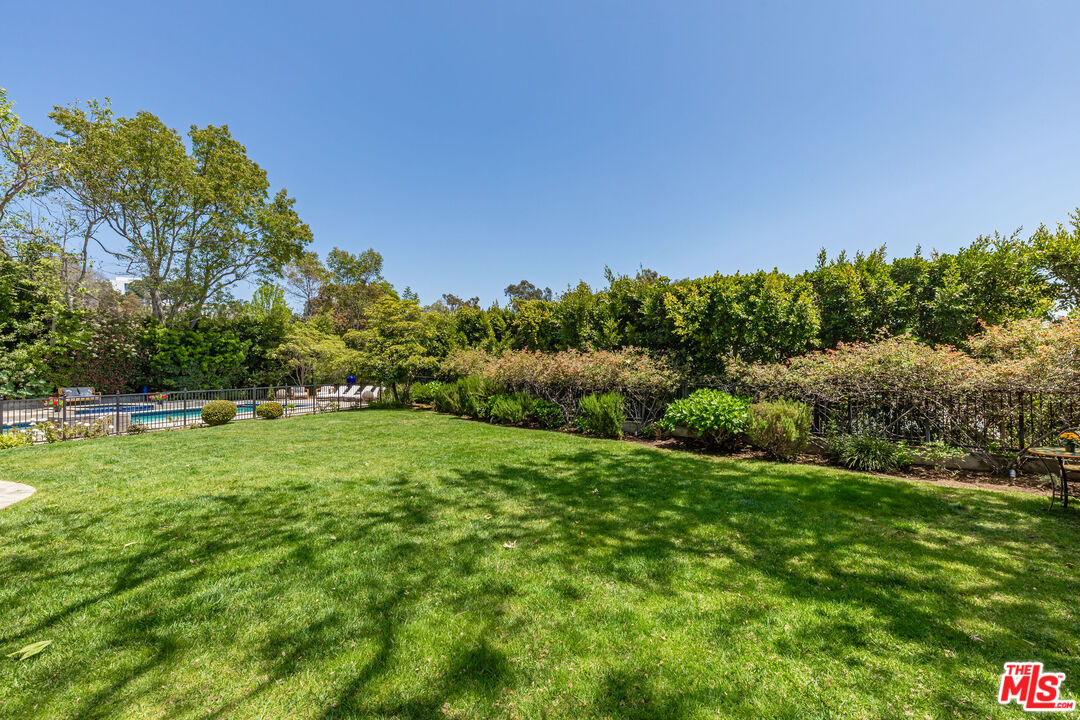 1756 Correa Way Los Angeles, CA 90049 - Photo 32 of 38 a view of a grassy field with trees