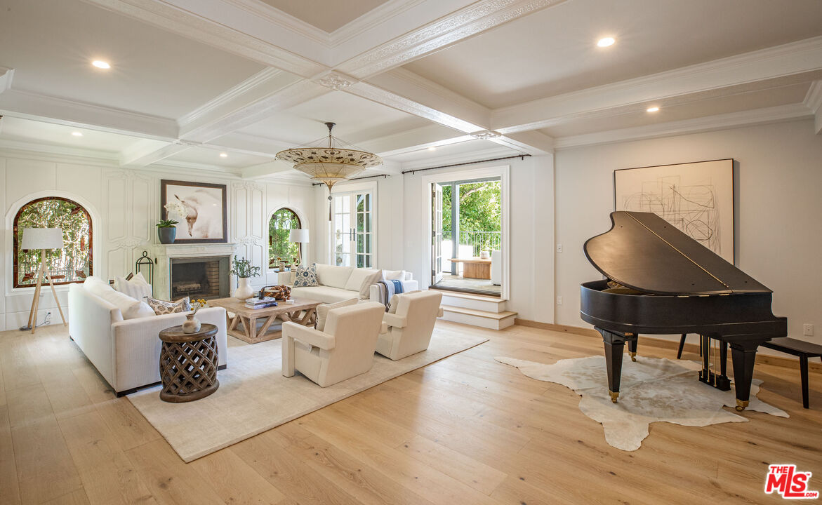 1756 Correa Way Los Angeles, CA 90049 - Photo 5 of 38 a living room with fireplace furniture and a large window