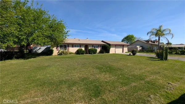 a house view with a garden space