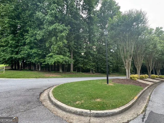 a view of a swimming pool with a yard
