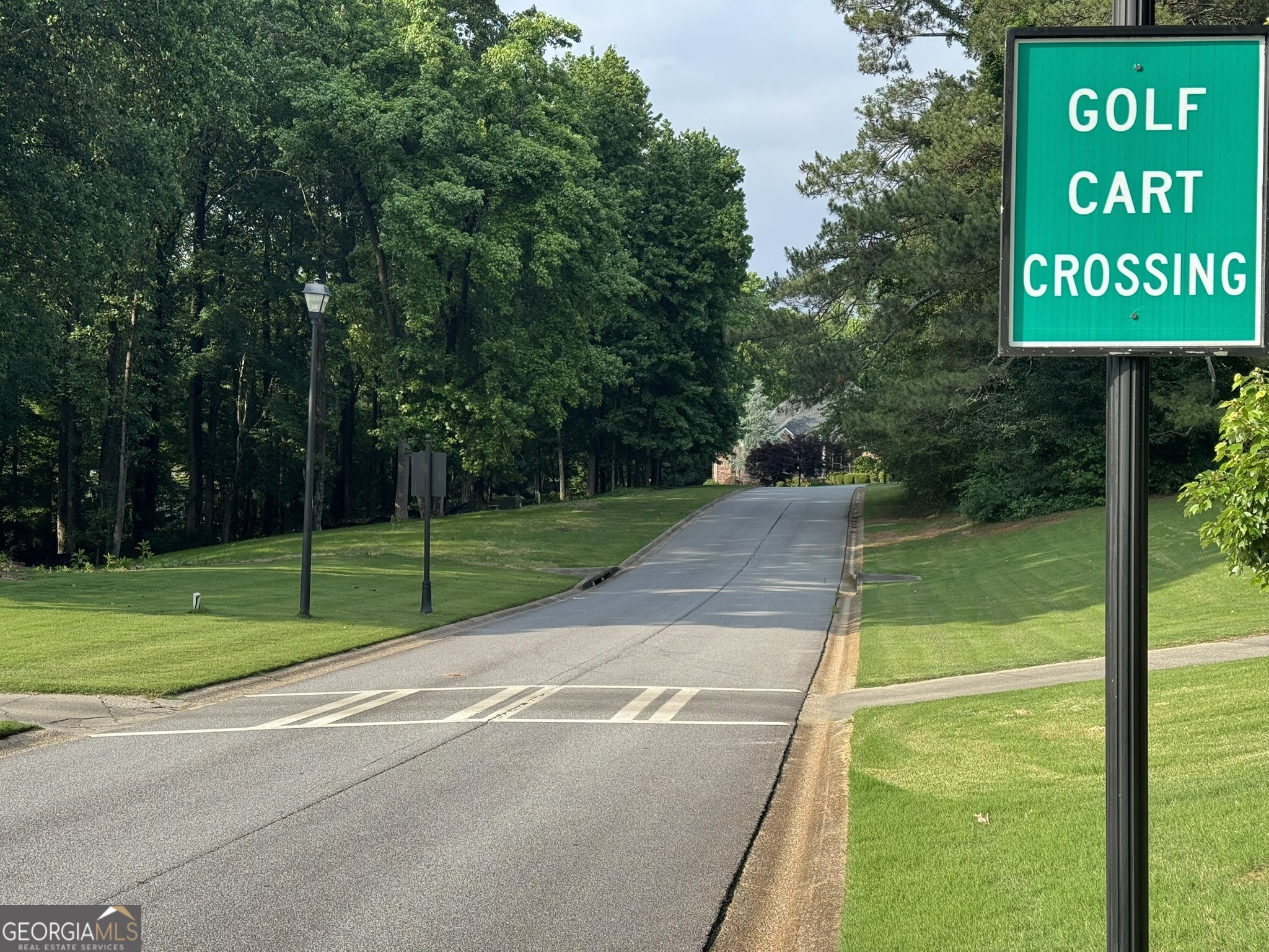 4708 Upper Berkshire Road, Unit LOT 39 Flowery Branch, GA 30542 - Photo 3 of 22 a sign board with garden