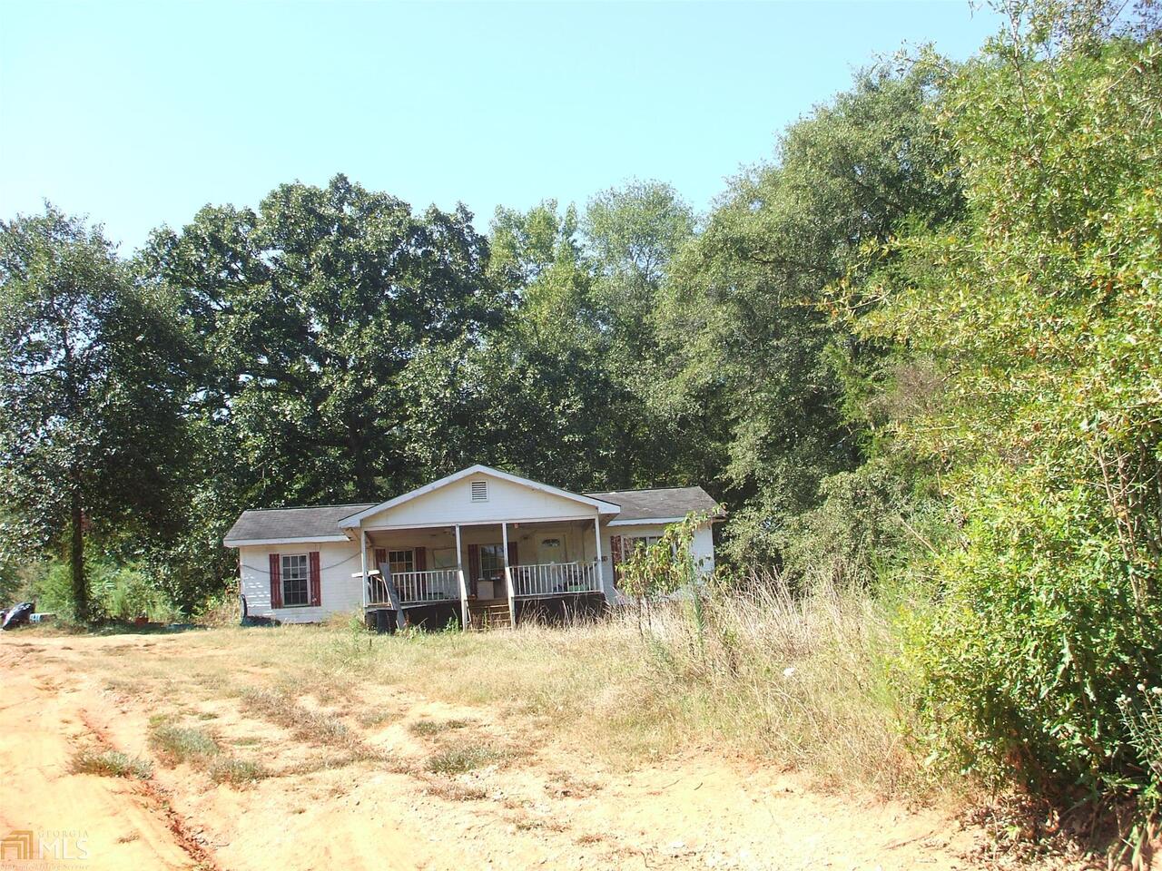 920 A C Smith Road Commerce, GA 30530 - Photo 1 of 1 a front view of a house with a yard
