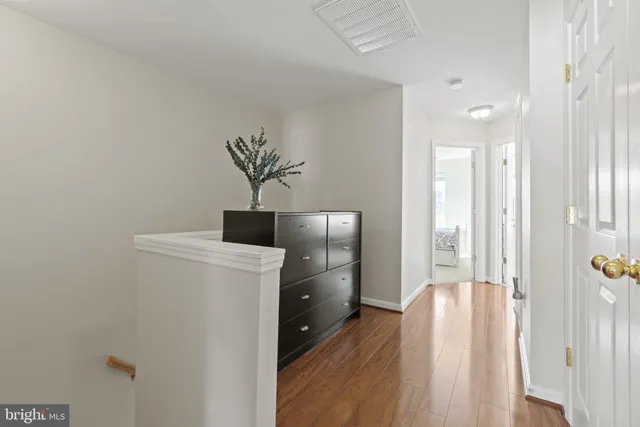 a kitchen with a refrigerator and cabinets
