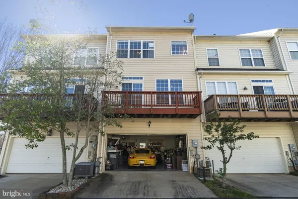 a couple of cars parked in front of a building