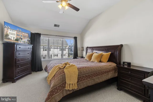 a bedroom with a bed and a dresser