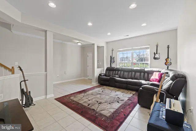 a living room with furniture and a rug