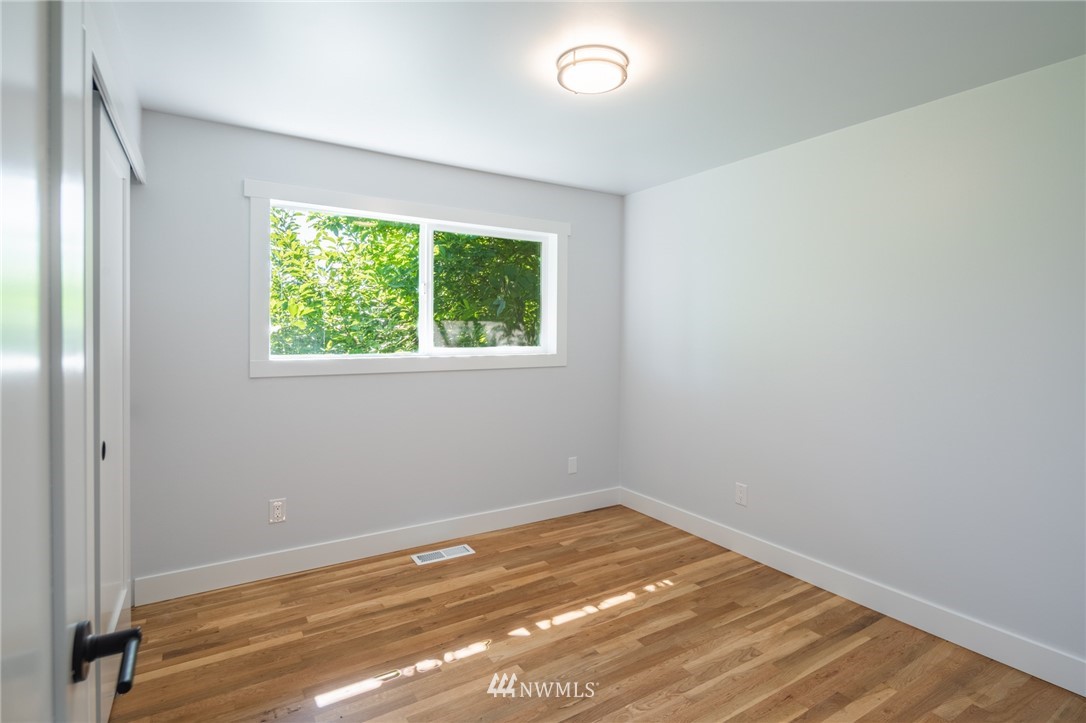 16504 124th Avenue Southeast Renton, WA 98058 - Photo 14 of 29 an empty room with a window