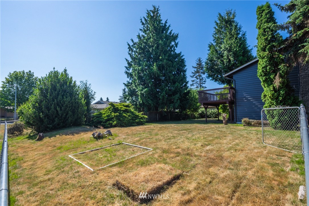 16504 124th Avenue Southeast Renton, WA 98058 - Photo 22 of 29 a view of a house with a yard and garage