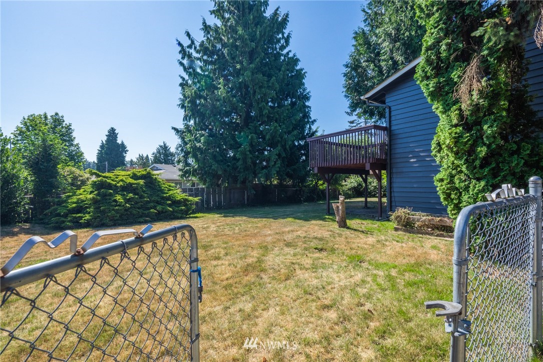 16504 124th Avenue Southeast Renton, WA 98058 - Photo 23 of 29 a balcony with trees in front of it