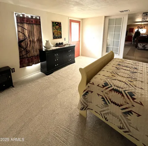 a bedroom with a bed and window