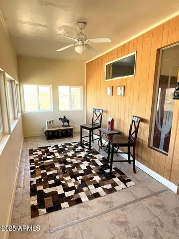 a living room with a couch and a chandelier