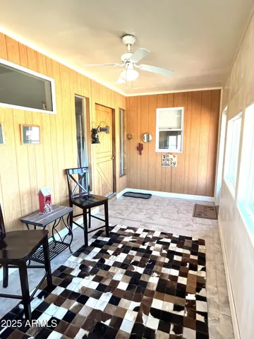 a living room with furniture and a window