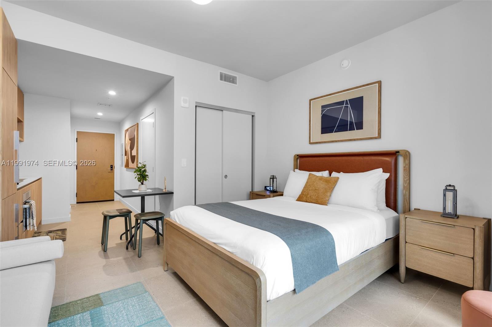 11 Northeast 6th Street, Unit 2808 Miami, FL 33132 - Photo 15 of 57 a bed room with a bed and a couch