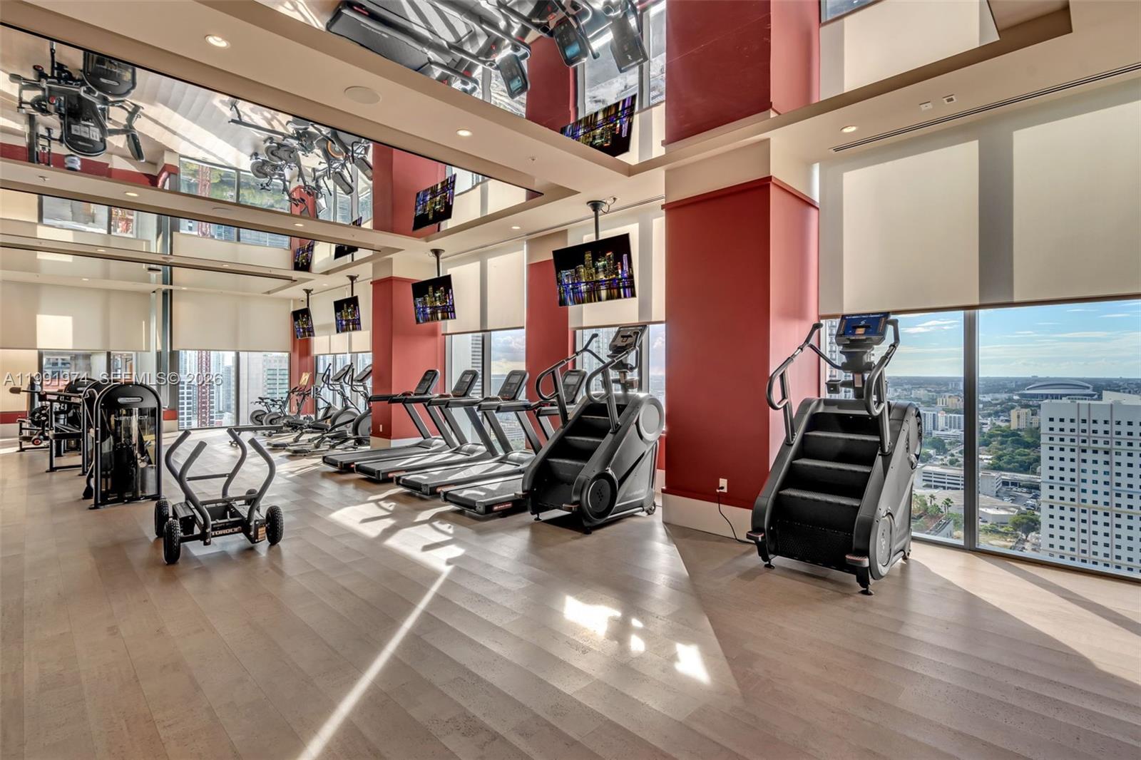 11 Northeast 6th Street, Unit 2808 Miami, FL 33132 - Photo 33 of 57 a view of a room with gym equipment