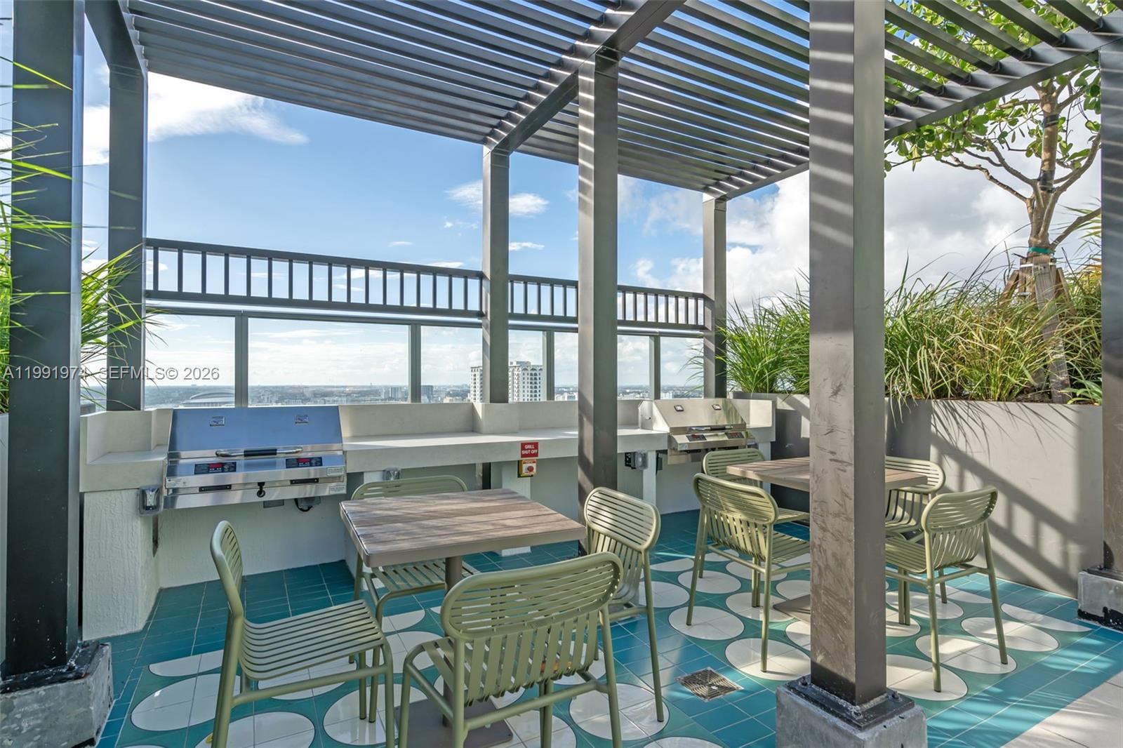 11 Northeast 6th Street, Unit 2808 Miami, FL 33132 - Photo 38 of 57 a view of a chairs and table in the patio