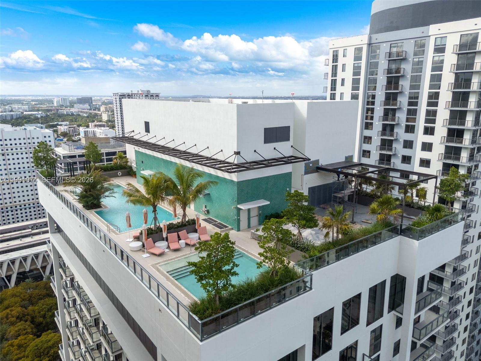 11 Northeast 6th Street, Unit 2808 Miami, FL 33132 - Photo 52 of 57 a view of a balcony with chairs