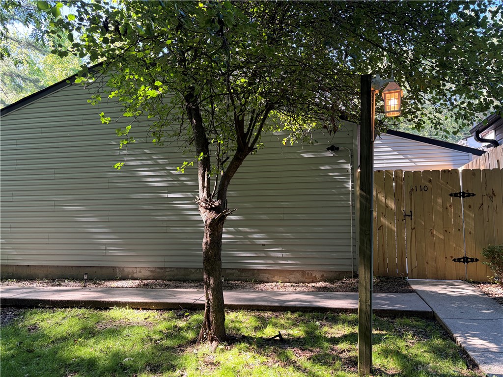 125 Maple Street, Unit 110 Pendleton, SC 29670 - Photo 1 of 22 Secure yard entry with a sturdy wooden fence and private side access with a custom light leading the way!