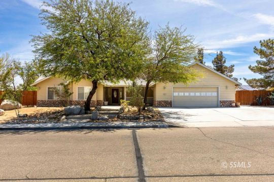 422 Vista Street Ridgecrest, CA 93555 - Photo 1 of 38 a front view of a house with trees