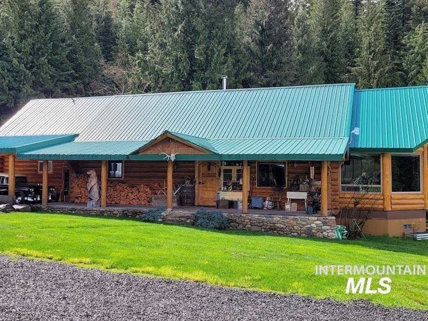 112 Three Forks Road Kamiah, ID 83536 - Photo 8 of 45 View of front of house featuring covered porch, a metal roof, crawl space, and log siding