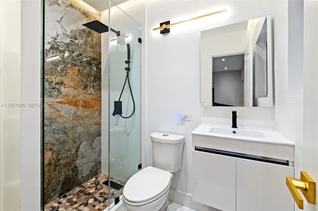a kitchen with a table chairs and a wooden floor