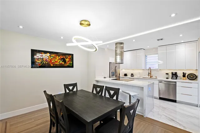 a view of a dining room and a table and chairs in a room