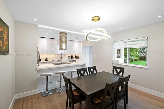a kitchen that has a lot of cabinets and refrigerator